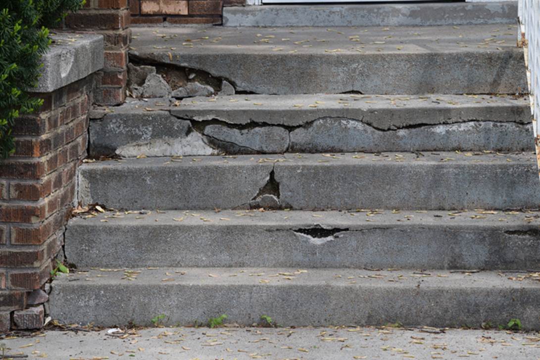 A close-up of a broken concrete staircase
AI-generated content may be incorrect.